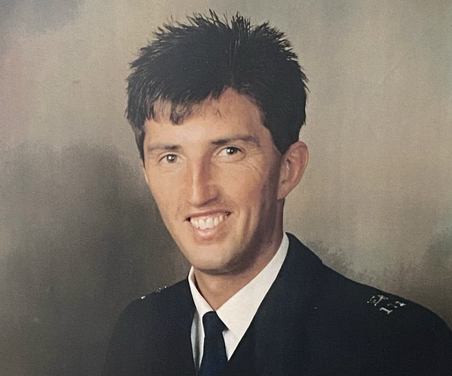 PC Garry Wozencroft has short dark hair, wearing his police uniform
